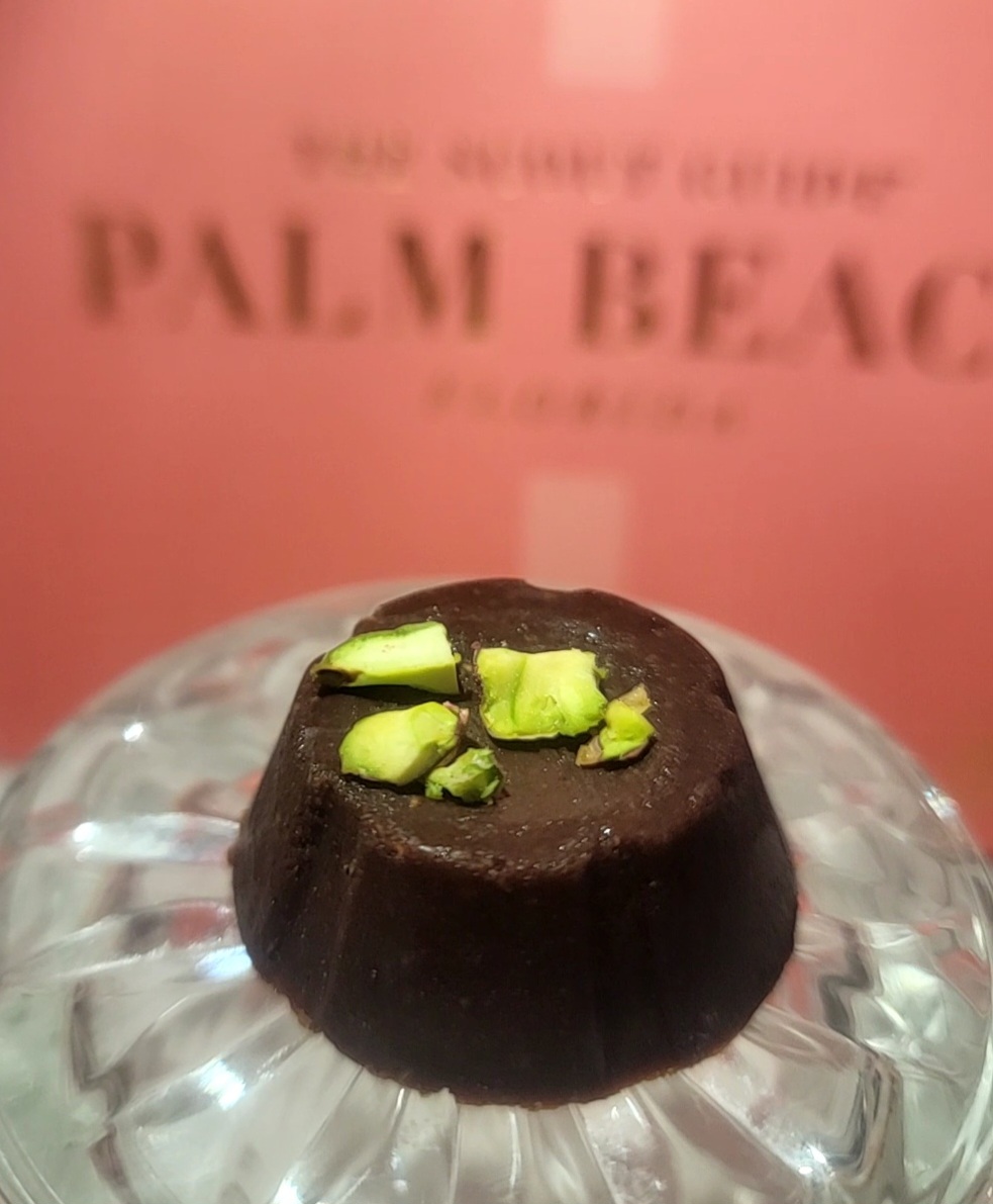 EnChoc pistachio chocolate piece on crystal glass