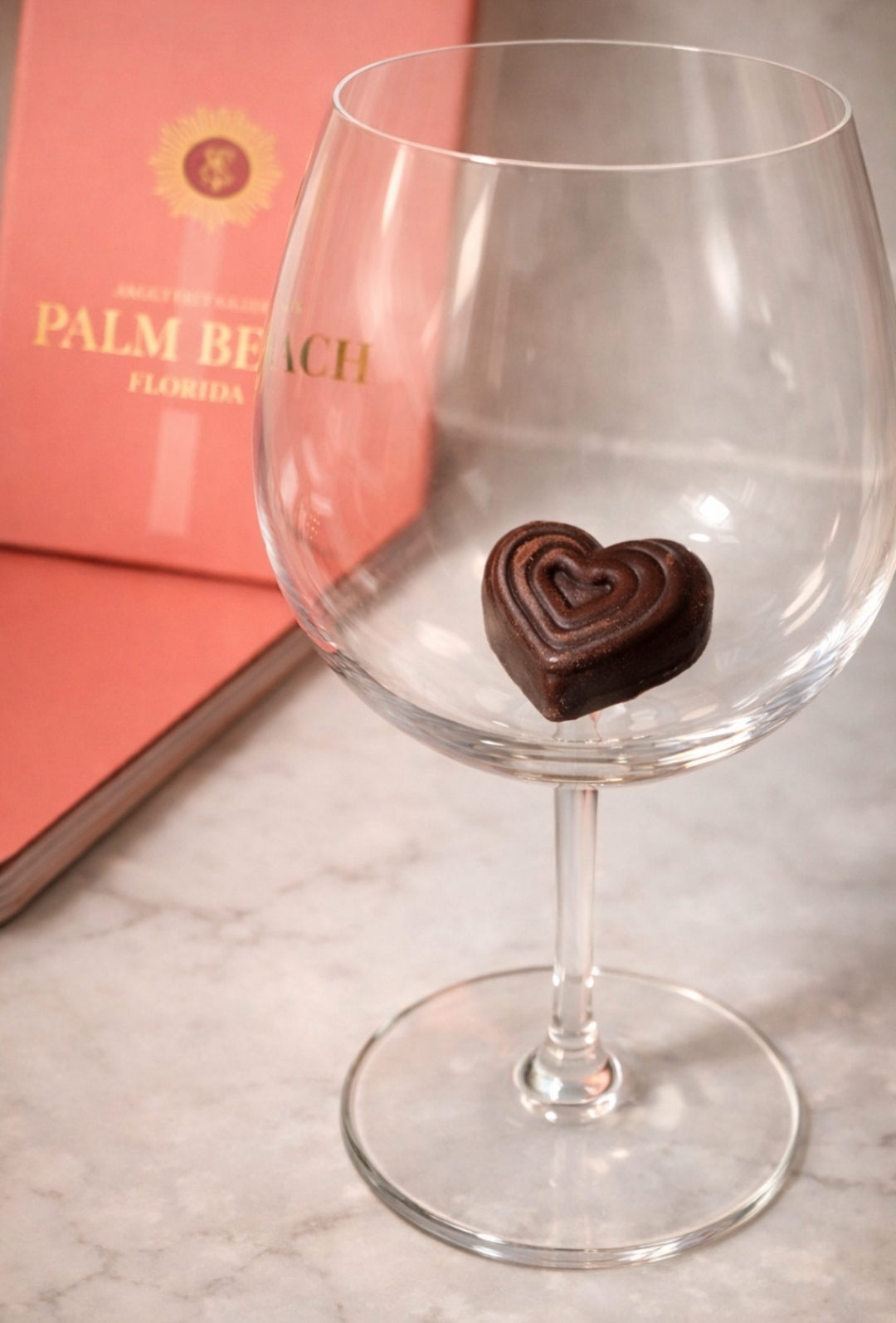 EnChoc heart chocolate in wine glass with Palm Beach branding